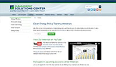 A blurry screenshot of the Clean Energy Solutions Center website, showing navigation links, a YouTube video thumbnail, and sections about clean energy policy training webinars.