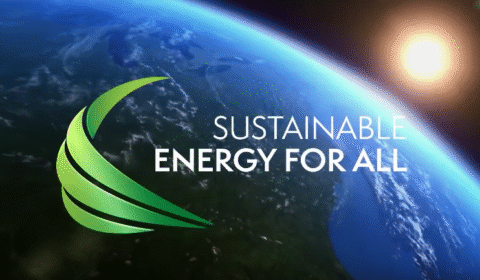 View of Earth from space with the sun shining, a green abstract logo on the left, and the words Sustainable Energy for All in white text to the right of the logo.