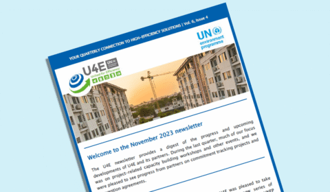 Newsletter with blue header and UN Environment Programme logo, featuring a photo of an apartment complex and construction crane. The title reads Welcome to the November 2023 newsletter..